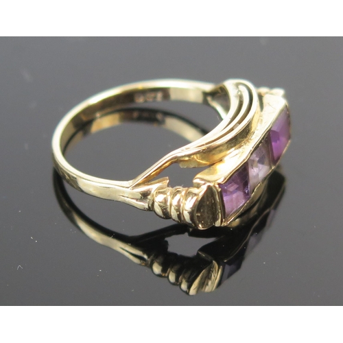 202 - A 9ct Gold and Amethyst Three Stone Ring with two tones, c. 21x`10mm head, size O, 3.5g