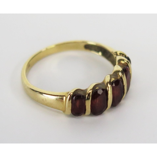 217 - A Modern 9ct Gold and Orange Stone Dress Ring, size N.75