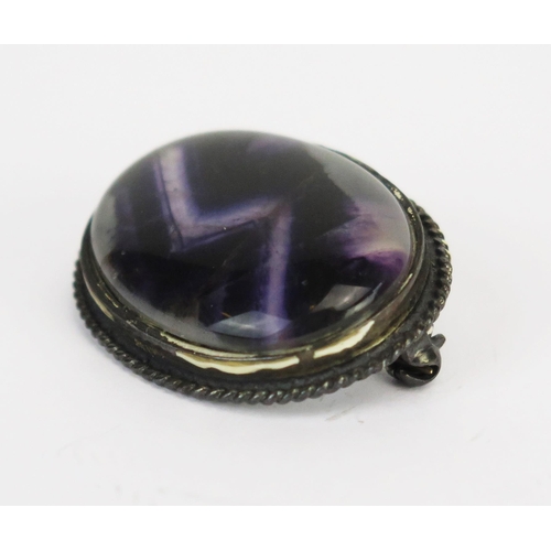 227 - A Blue John Fluorite Brooch in a silver mount, c. 27.5x22mm