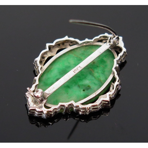 36 - An 18ct White Gold and Diamond Brooch with Carved and Pierced Jadeite Panel in original Muir Nicol o... 