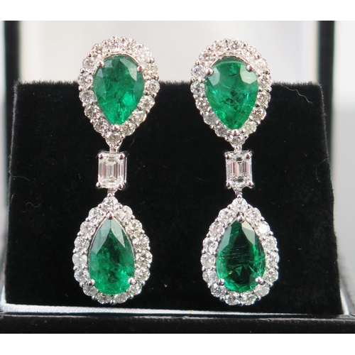 49 - A Pair of 18ct White Gold, Emerald and Diamond Pendant Earrings formed as twin pear drops, one inver... 