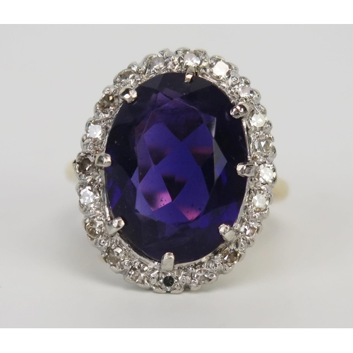 60 - An 18ct Gold, Amethyst and Diamond Cluster Ring, 16x12mm central stone surrounded by c. 2mm diamonds... 