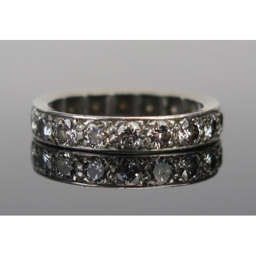 65C - A Good Diamond Full Eternity Ring in a precious white metal setting (probably platinum), c. 3mm ston... 