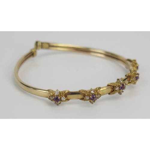 70 - A 9ct Gold, Amethyst and White Stone Torque Bangle, 8.7g