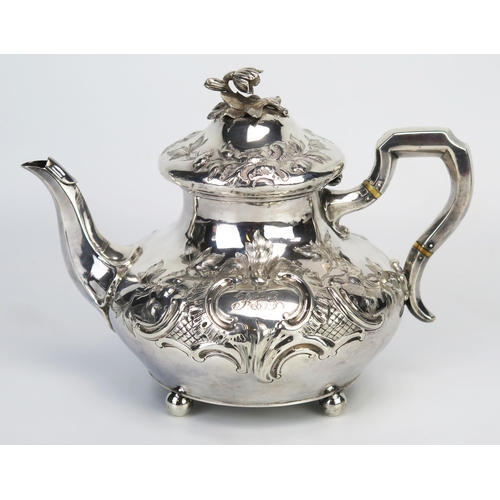 726 - A Victorian silver teapot, maker William Ker Reid, London, 1848, Crested and initialled, of compress... 