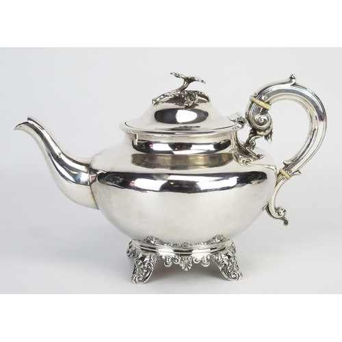 731 - A Victorian silver teapot, maker H J Lias & Son, London, 1854, with shallow domed hinged lid with fl... 