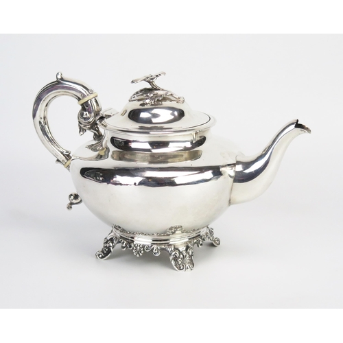 731 - A Victorian silver teapot, maker H J Lias & Son, London, 1854, with shallow domed hinged lid with fl... 