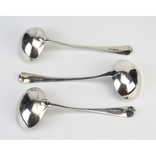 733 - Three Georgian silver Old English pattern sauce ladles, various makers and dates, two being monogram... 