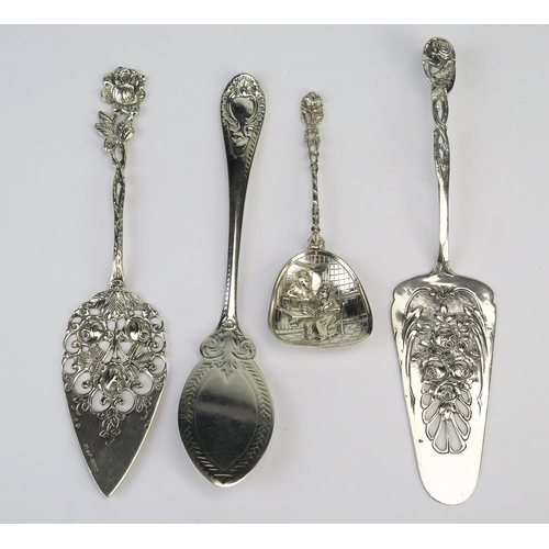 745 - Two continental silver slices, each with pierced and foliate decorated blades, a Victorian silver sl... 