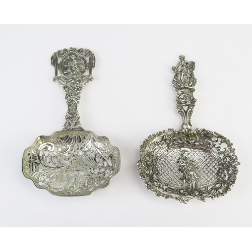 747 - A continental silver straining spoon, bears import marks, with pierced cartouche-shaped bowl, floral... 