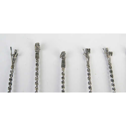 752 - A collection of African silver coffee spoons, together with assorted plated souvenir spoons.