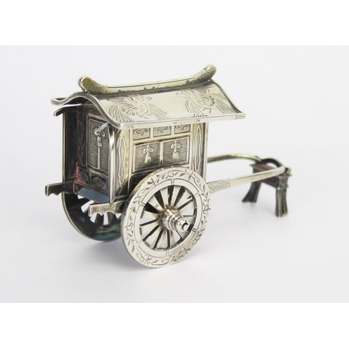 759 - A Chinese silver model of a bridal cart, the slide-off roof with mythical bird decoration, raised on... 