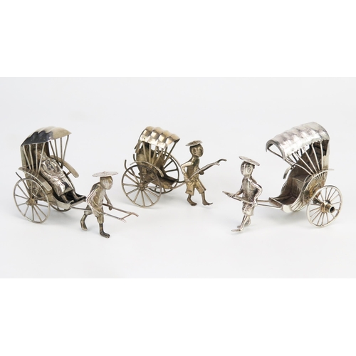 760 - Three oriental silver models of rickshaws, one with passenger, 9cm and 7cm long, total weight of sil... 