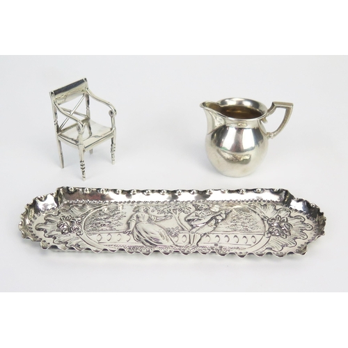 761 - A Victorian silver pin tray with embossed decoration of a minstrel serenading  to a young lady, 15cm... 