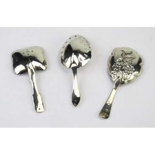 769 - Three assorted silver caddy spoons, most marks rubbed and worn, total weight of silver 25gms, 0.83oz... 