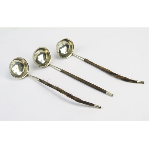 780 - A set of three silver toddy ladles, with circular bowls on spiral twist baleen handles