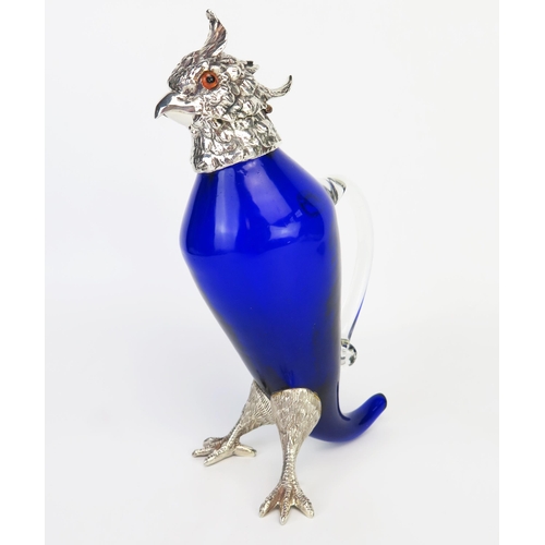 788 - A blue glass and silver plate mounted claret jug, in the form of a parrot, the hinged head with beak... 