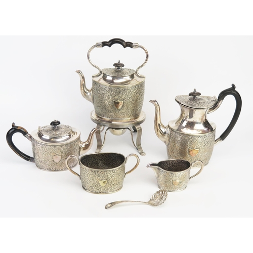 791 - An electro-plated five piece tea and coffee service, of oval outline, with foliate and scroll decora... 