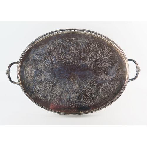 792 - A silver plated oval serving tray, with chased foliate and scroll decoration, galleried border and l... 