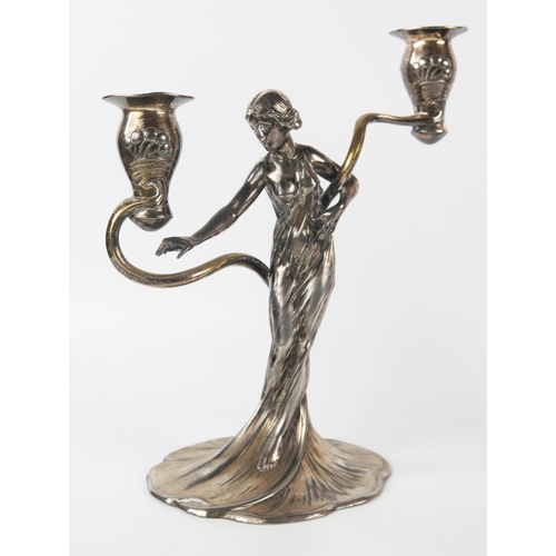 794 - WMF, a pair of Jugendstil silver plated figural twin branch candelabra, the sconces on sinuous swept... 