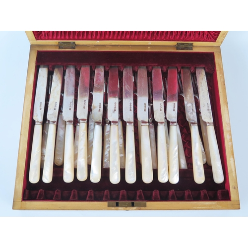 798D - A set of twelve Victorian silver and mother-of-pearl handled fruit knives and forks, maker Henry Atk... 