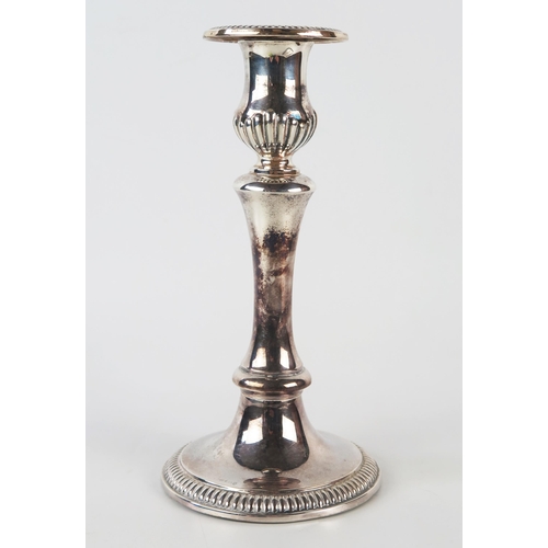 799 - A Continental silver candlestick with urn-shaped sconce on a waisted stem and domed circular weighte... 