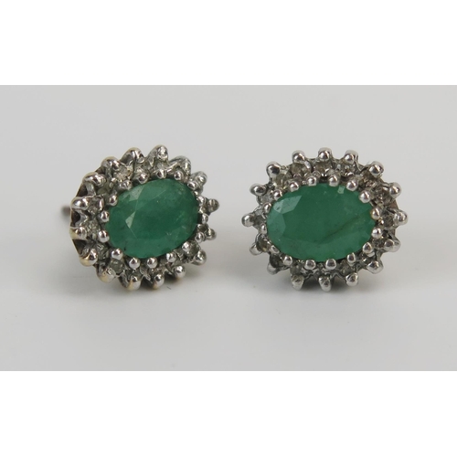 83 - A Pair of 9ct Gold, Emerald and Diamond Oval Earrings (Birmingham hallmarks), 11x9.5mm head, 2.8g an... 