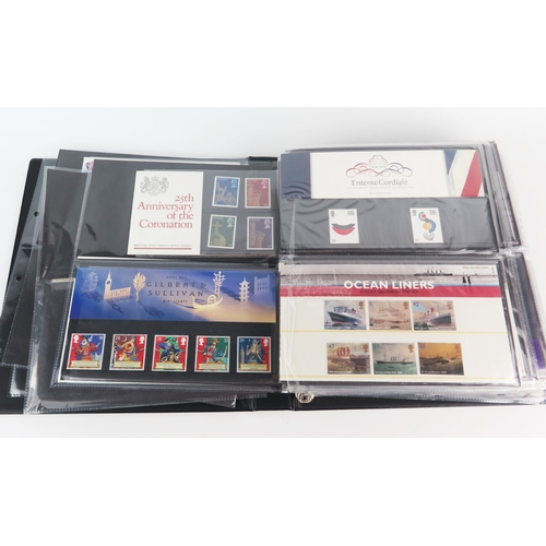 910E - A Collection of GB Mint Stamp Packs arranged in three albums and a small number of first day covers