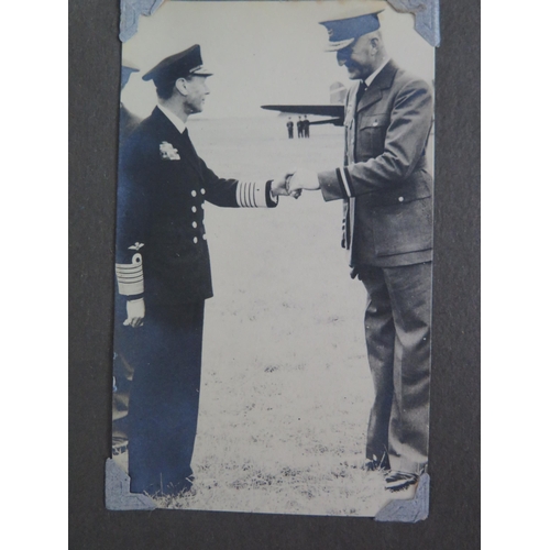 917 - A personal album of photographs of R.A.F. personnel, aircraft, Montgomery, King George VI and native... 