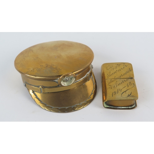 919 - A World War One trench art miniature brass box in the form of a peaked cap together with a brass cig... 