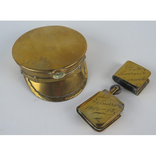 919 - A World War One trench art miniature brass box in the form of a peaked cap together with a brass cig... 