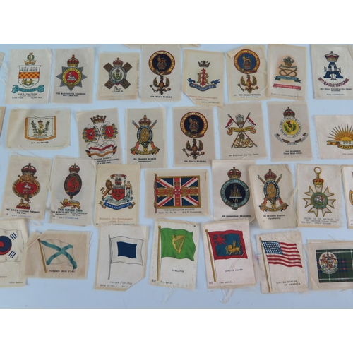 920 - A collection of Kensitas cigarette silks, includes Regimental badges, Regimental Colour, and General... 