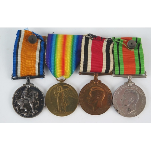 921 - A World War One group of four to 8-37136. Pte. L.C.Cornelius. Devon. R. includes 19134-18 War Medal ... 