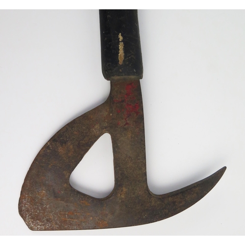 931 - An R.A.F. Bomber Command axe, with shaped and pierced head, having a rubberoid handle to the shaft, ... 