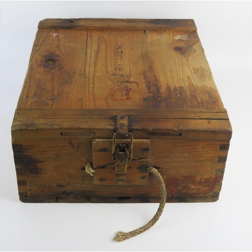 933 - A German stained wood ammunition box, with hinged lid and metal clasp, stencilled marks.45cm long.