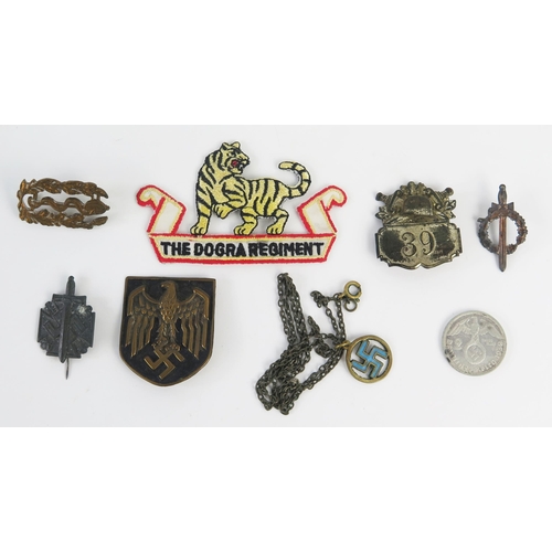 938 - A Third Reich period pressed metal badge with National Emblem, other assorted badges and pendant