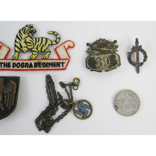 938 - A Third Reich period pressed metal badge with National Emblem, other assorted badges and pendant