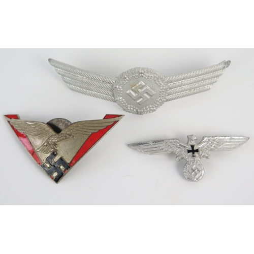 942 - A Third Reich period Luftwaffe metal and enamel badge, with national Emblem , a cap badge and a lape... 