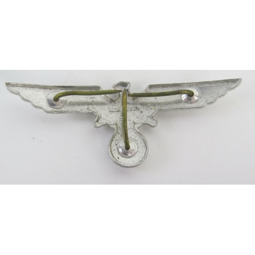 942 - A Third Reich period Luftwaffe metal and enamel badge, with national Emblem , a cap badge and a lape... 