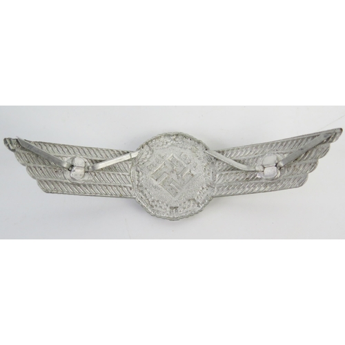 942 - A Third Reich period Luftwaffe metal and enamel badge, with national Emblem , a cap badge and a lape... 