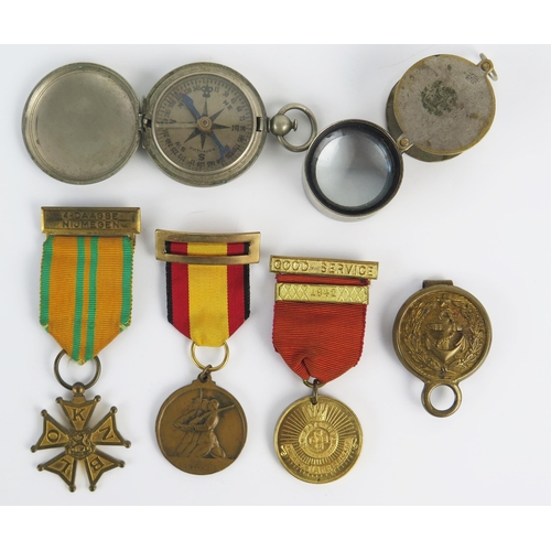 943 - A Dutch Cross of the Four Day Marches, two other medals, an American compass, a magnifying glass, Na... 