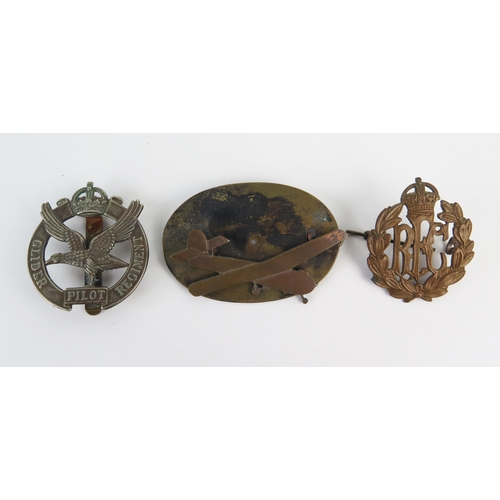 948 - A Royal Flying Corps cap badge, A Glider Pilot Regiment cap badge, a brass glider badge.