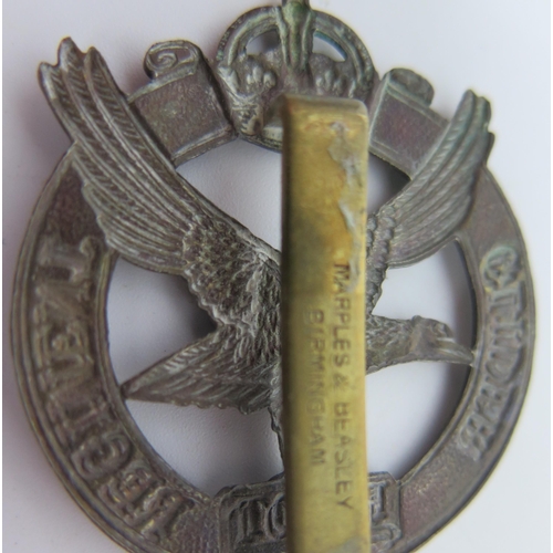 948 - A Royal Flying Corps cap badge, A Glider Pilot Regiment cap badge, a brass glider badge.