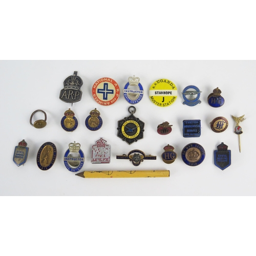 951 - A collection of assorted metal and enamel lapel badges, Civil Defence badges, Athletes Volunteers Fo... 