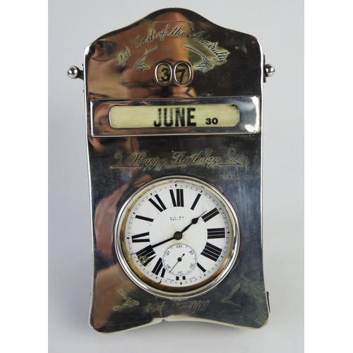 970 - OF WINSTON CHURCHILL INTEREST
A silver framed desk top perpetual calendar and watch holder, makers m... 