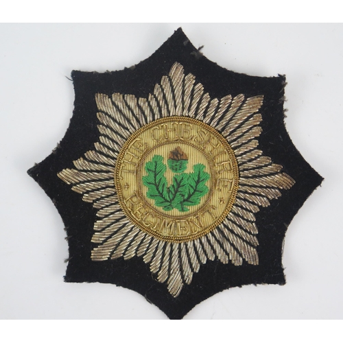 979 - A Cheshire Regiment cloth badge.