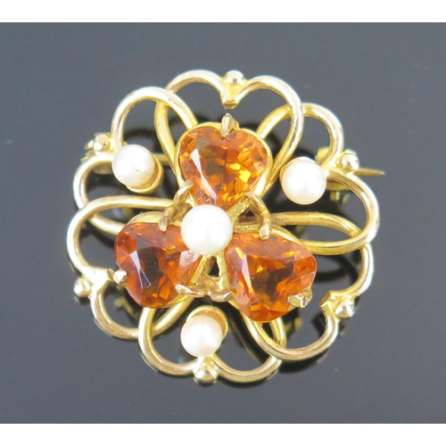 98 - A 9ct Gold, Citrine? and untested Pearl Brooch (25mm diam., 5g) and 9ct gold front and back locket w... 