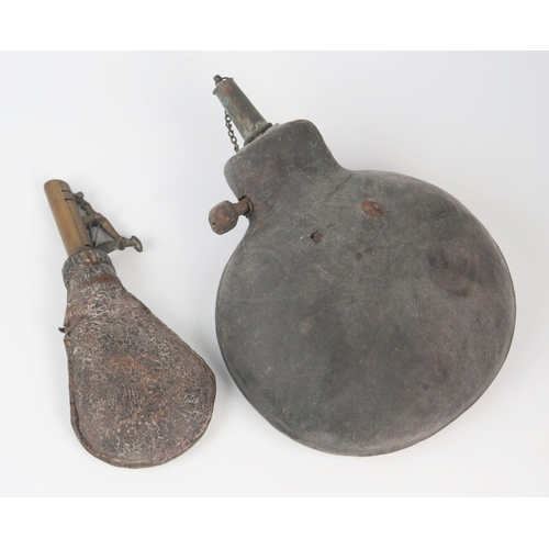 984 - A stitched leather powder flask, of circular outline, 18cm wide, together with a leather shot flask.... 