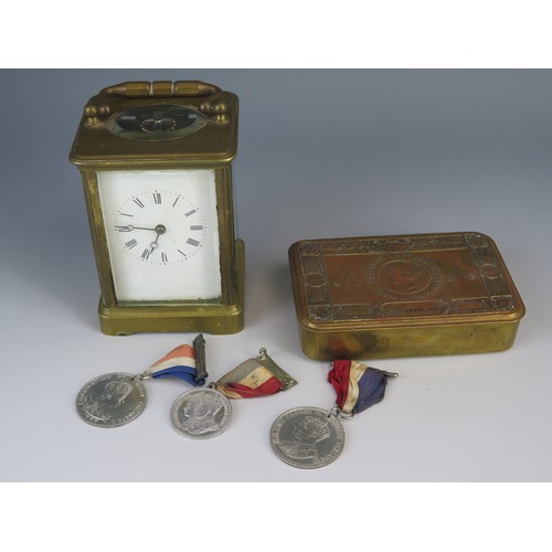 975A - A WWI 1914 Christmas Tin, three commemorative medallions and carriage clock (running )