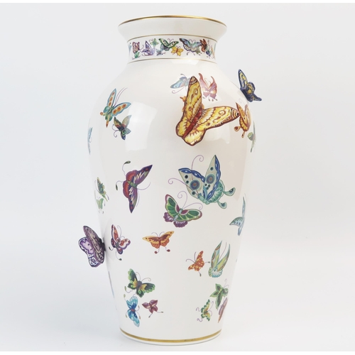 1357 - A Franklin Mint porcelain vase, decorated with painted and applied butterflies, 30cm high.